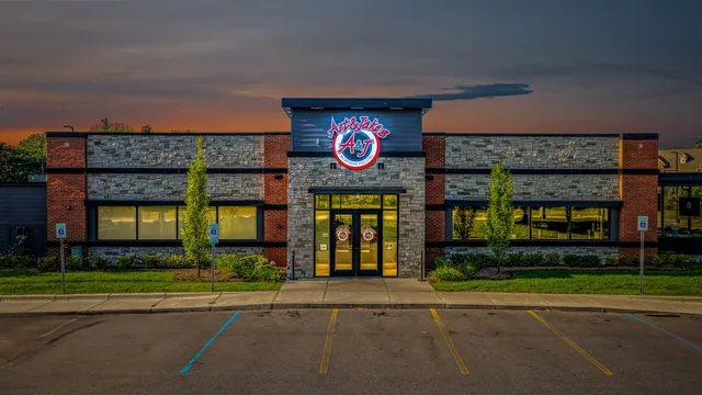 The Northville restaurant at dusk, the sign lit above the entrance