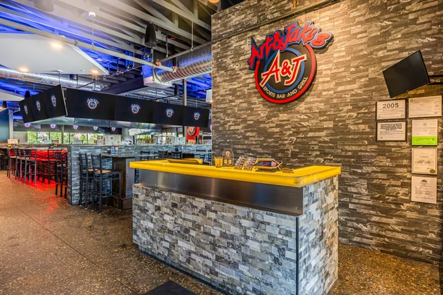 The Northville bar, stone front and a lit counter under the logo