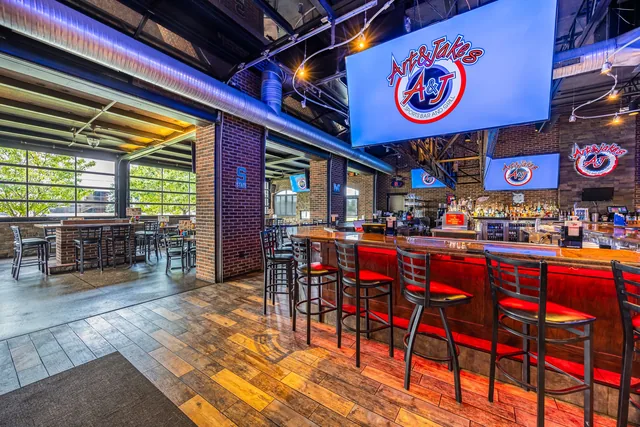 The Shelby Township bar with the garage doors rolled open to the outside
