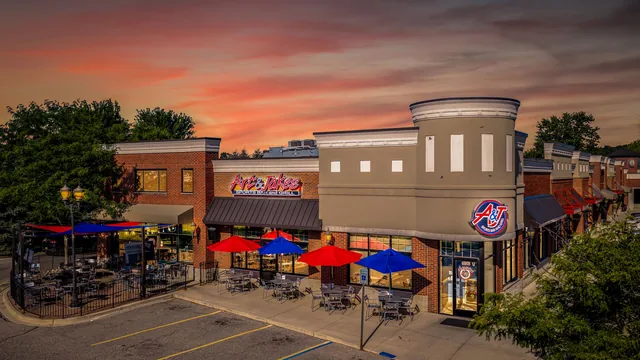 The Washington restaurant at sunset, red and blue umbrellas over the patio
